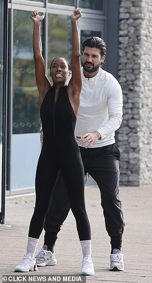 Vanessa looked amazing in a black jumpsuit while training