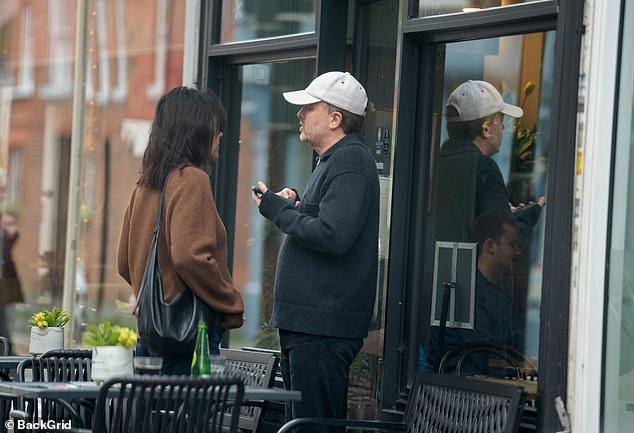 The couple was seen chatting outside.