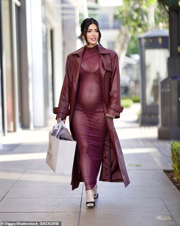 The actress, 38, who announced she was expecting her first child with partner Machine Gun Kelly, 34, earlier this month, showed off her blossoming stomach and lingerie as she made a glamorous appearance at The Grove.