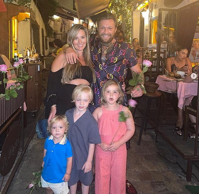 Devlin and McGregor are pictured above vacationing with their children while Devlin was pregnant with her fourth child.