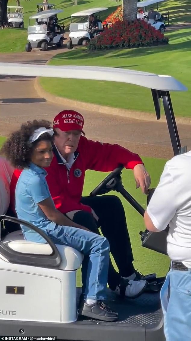 The young woman then climbs into Trump's golf cart to take a photo with the president-elect.