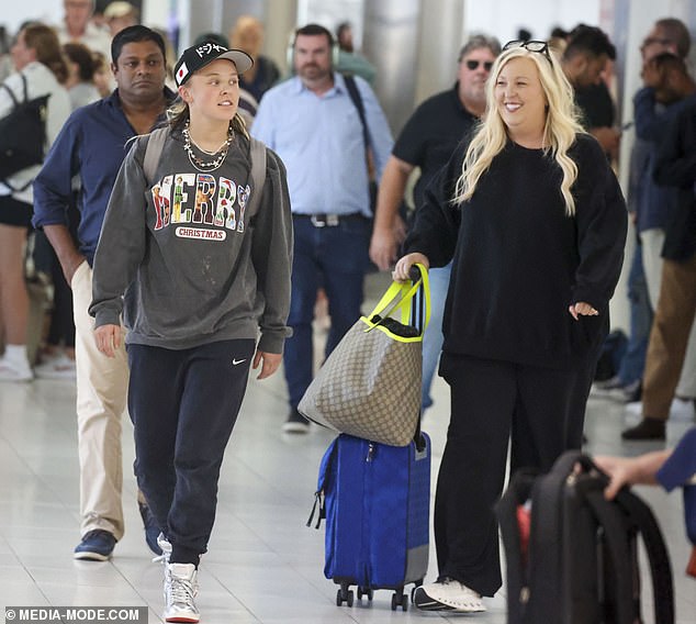 The Dance Moms star, 21, seemed to be in good spirits as she toured arrivals with Jessalynn on their first visit to Australia in more than four years.