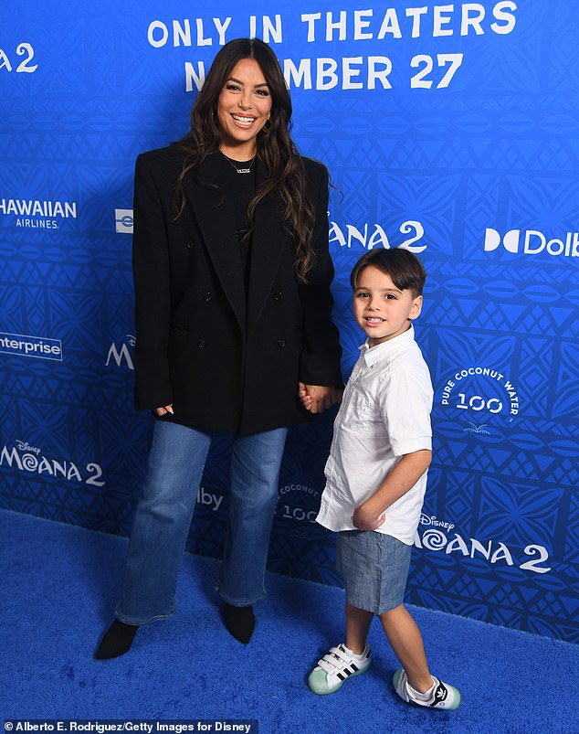 The producer and Land of Women star, 49, held hands with her six-year-old mini-me, whom she coordinated with in a blue denim outfit.