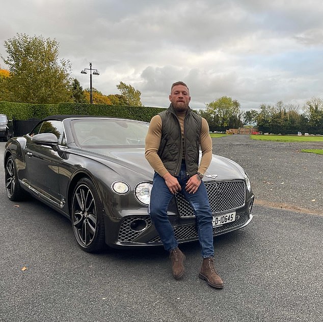 McGregor poses with his £110,000 Bentley Continental GT Speed ​​convertible