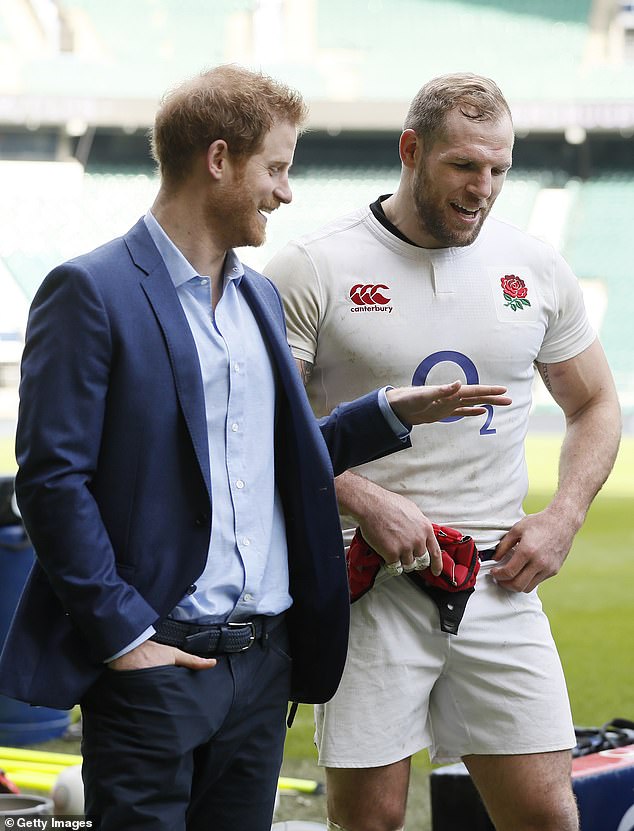 Prince Harry speaks with James Haskell during a visit to Twickenham Stadium in February 2017