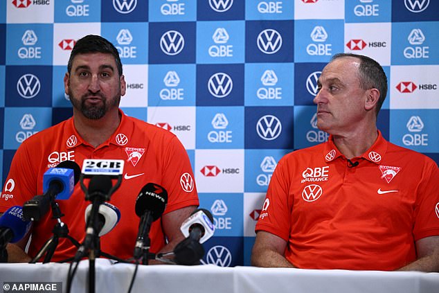 Dean Cox (left) will succeed Longmire (right) as the club's new senior coach, with Cox apparently already overseeing the Swans' draft.