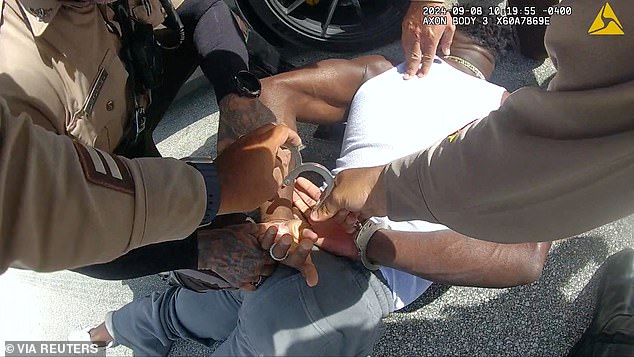 The wide receiver was pinned to the ground by officers prior to the Dolphins' season opener