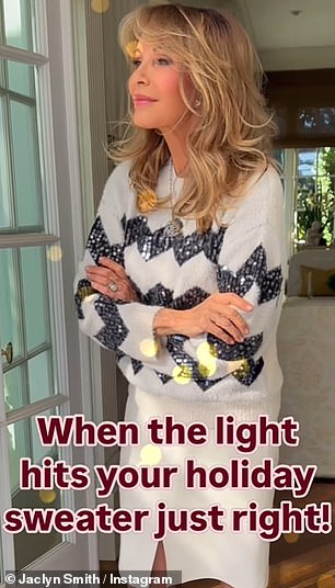 Her new video shows her standing by the window, allowing sunlight to stream onto her sequined Christmas sweater.