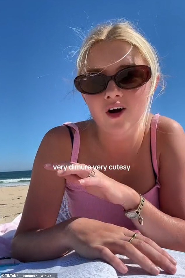 Summer, an Australian content creator, recorded a clip of her 'demurely' studying on the beach