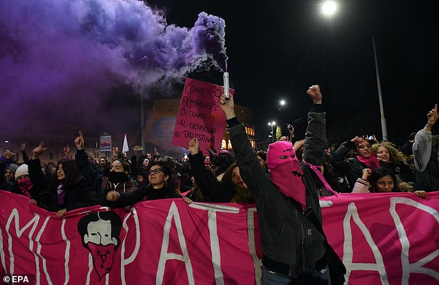 People take part in a protest against patriarchal violence called by the feminist group Non Una Di Meno (Not one less) before the 