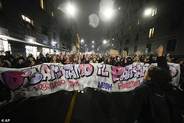 Women attend a demonstration to mark the International Day for the Elimination of Violence against Women, in Milan, Italy, Monday, November 25, 2024.