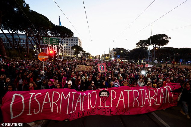 Women hold a banner as people from the Non Una di Meno (Not one less) movement and feminist groups participate in a protest ahead of the International Day for the Elimination of Violence against Women, in Rome, Italy, on November 23, 2024.