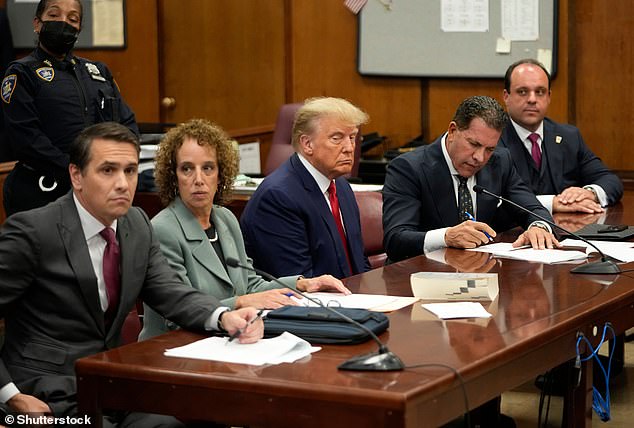 Epshteyn is seen here with Trump's legal team at the Manhattan Federal Courthouse in New York during the former president's arraignment in April 2023