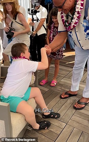 Ohnson brought Jazzy and Tia with him to meet and greet some Make-A-Wish recipients who had flown to Hawaii with their families for the movie premiere.