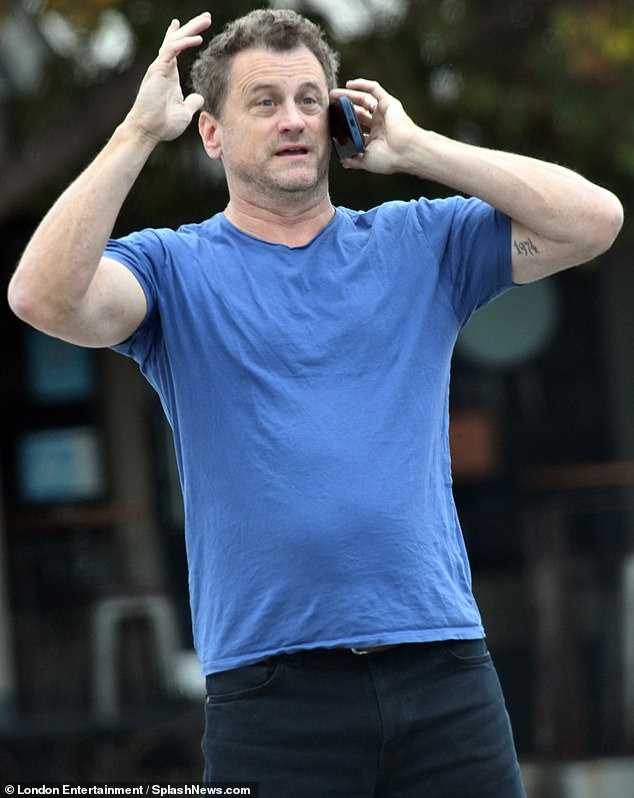 David, now 50, cut a stylish figure when he was spotted in Los Angeles this week, showing off his toned arms in a tight-fitting T-shirt.