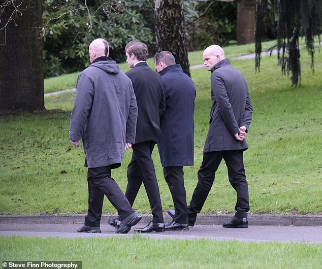 Members of Georgina Cooper's family, including her brother Paul Donnelly (right), today.