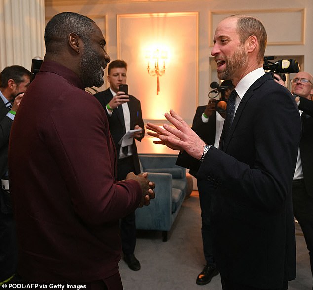 Britain's Prince William and Prince of Wales talks with actor and activist Idris Elba