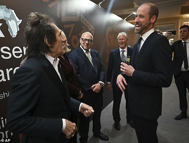 William appeared in high spirits as he shared a joke with Ronnie Wood, whom he also met at last year's awards.