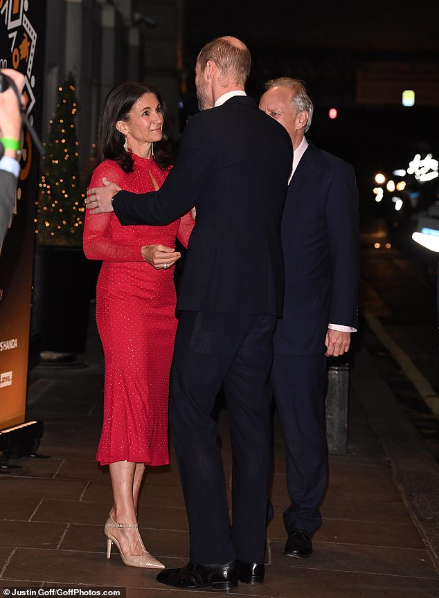 The Prince of Wales, 42, looked dapper in a navy suit as he arrived at the event at the Savoy Hotel and smiled as he greeted guests.