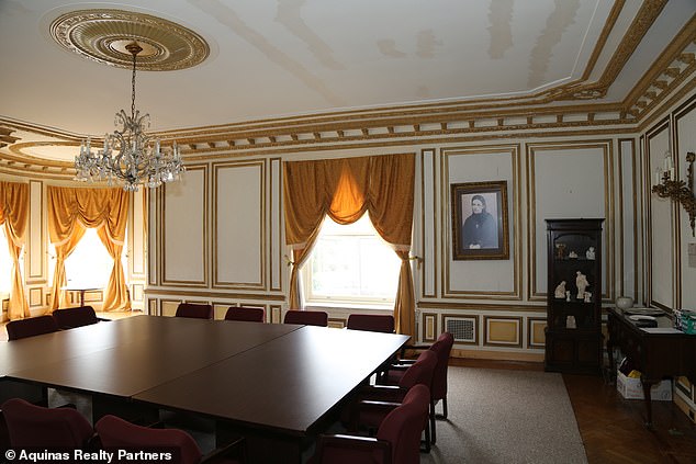 The dining room in the castle is shown