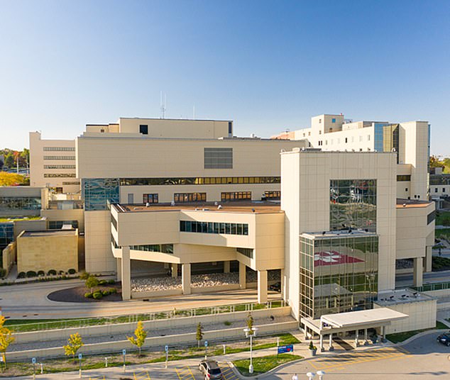 The couple arrived at Carle Health Methodist Hospital (pictured) where her young daughter was given a nasal swab to check for Covid-19 and influenza A and B.