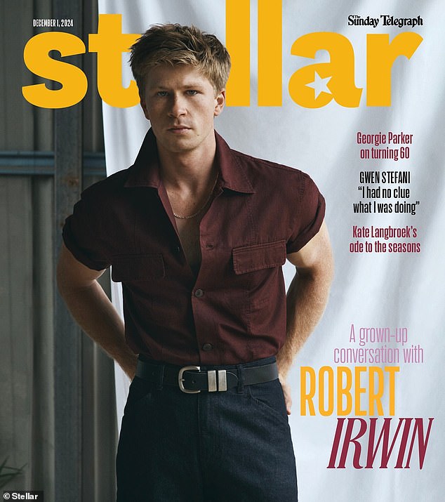 In the striking cover photo, Irwin, 20, dons a deep burgundy button-down shirt, partially unbuttoned to reveal a hint of her chest.