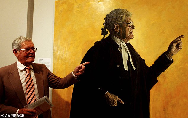 Chief Justice of New South Wales Andrew Bell described Hughes (pictured with his portrait in 2004) as 