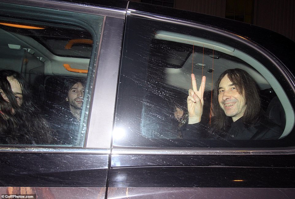 Bobby flashed a peace sign as he left the party in the back of a cab.