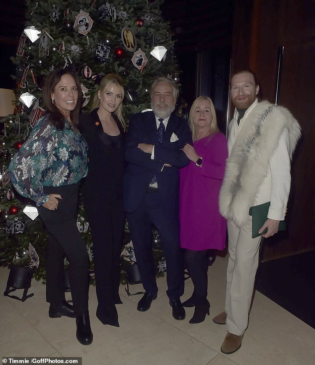 Lady Kitty Spencer poses with the charity's staff at the event held at 45 Park Lane