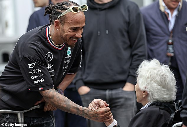 The racing legend is pictured with seven-time Formula 1 champion Lewis Hamilton in June