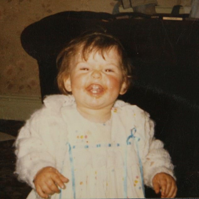 Another cheeky photo showed her covered in food that looked like ketchup when she was young as she flashed a toothy smile.