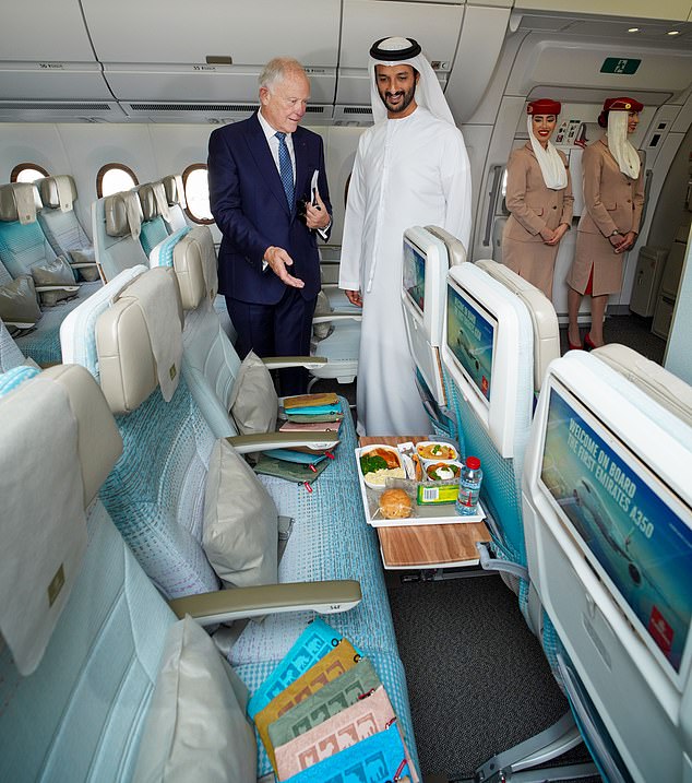 Sir Tim Clark, Chairman of Emirates Airline, shows the new Emirates A350 to His Excellency Abdulla Bin Touq Al Marri, Minister of Economy of the UAE