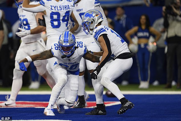 Jahmyr Gibbs and Amon-Ra St. Brown celebrate after scoring a touchdown last weekend