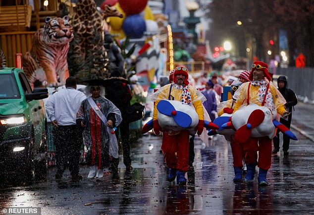 The annual holiday tradition began at 8:30 a.m. ET as a low-pressure system moved through the area, bringing wind, rain and plunging temperatures