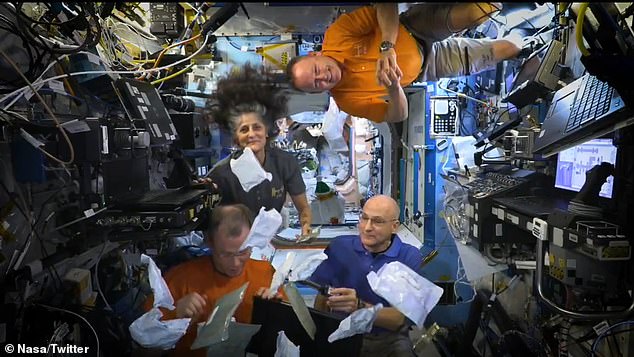 Smiling behind The Hague (bottom left) in the space station's holiday broadcast were the two NASA astronauts (top row) who have been stuck on the ISS since June - after the inaugural crewed flight of Boeing's Starliner spacecraft suffered malfunctions and gas leaks