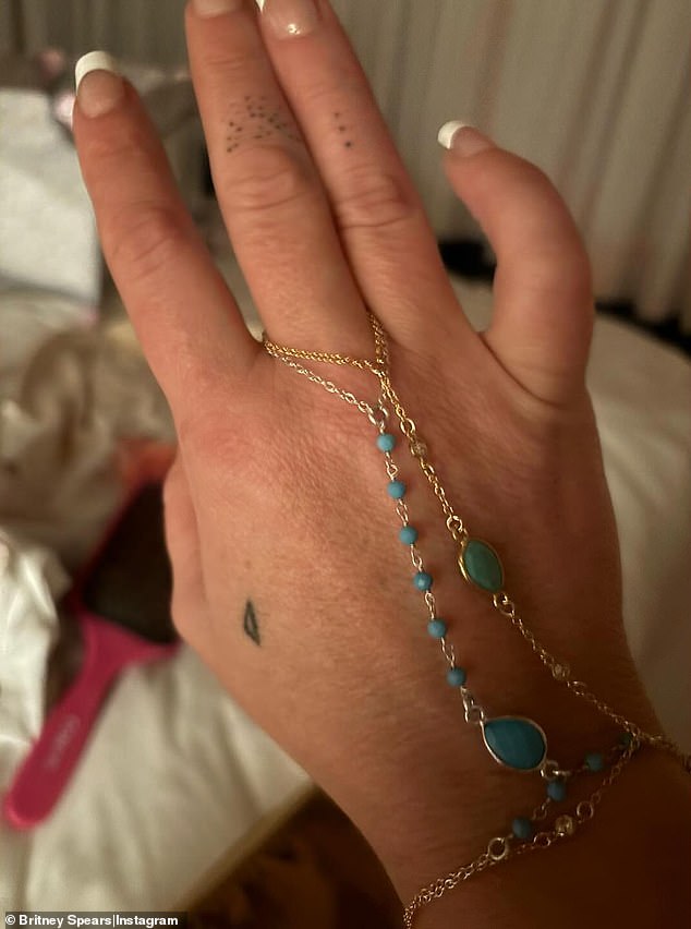 Britney has also been working on a new jewelry line, 'Tiny B', which promises to sell 'unique, delicate and extremely different pieces' (like the one pictured) that she has designed herself.