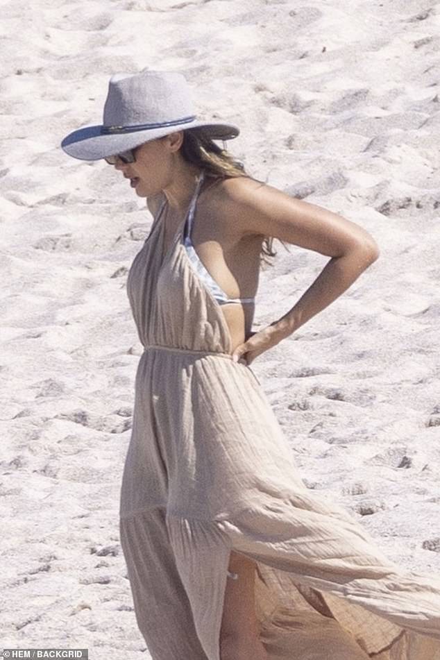 Jess wore a chic summer dress as she relaxed on the beach.