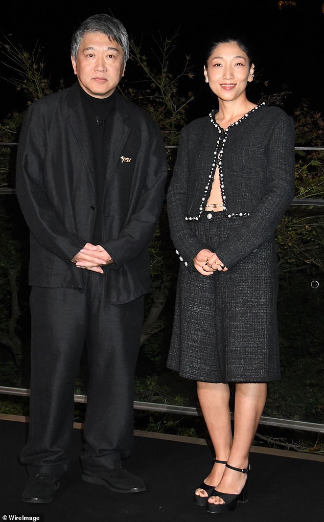 Director Hirokazu Kore-eda looked dapper alongside Sakura And, who wore a black tweed ensemble.