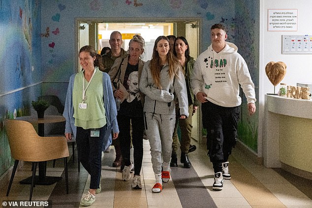 Schem is seen walking with members of his family at the Sheba Medical Center in Ramat Gan, Israel, after his release.