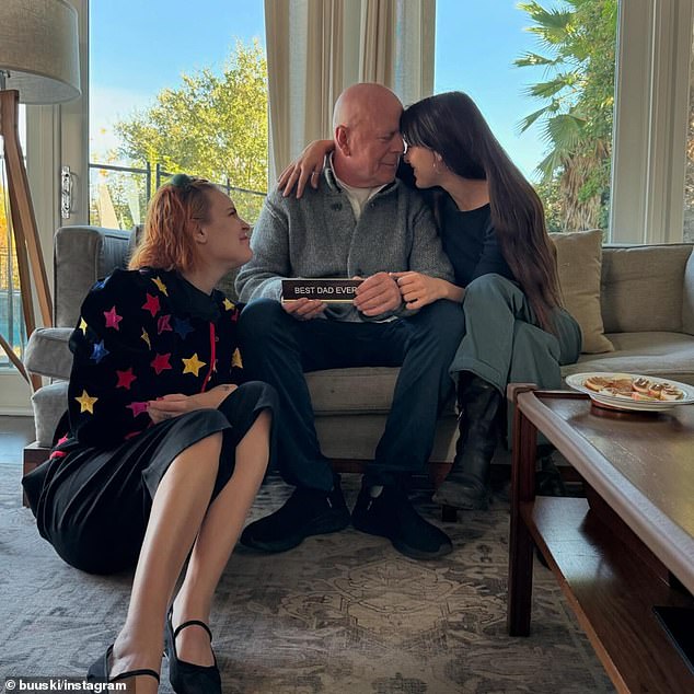 The retired actor, 69, was seen smiling at his daughter Scout, 33, while sitting on a couch while his daughter Tallulah, 30, watched from the floor.