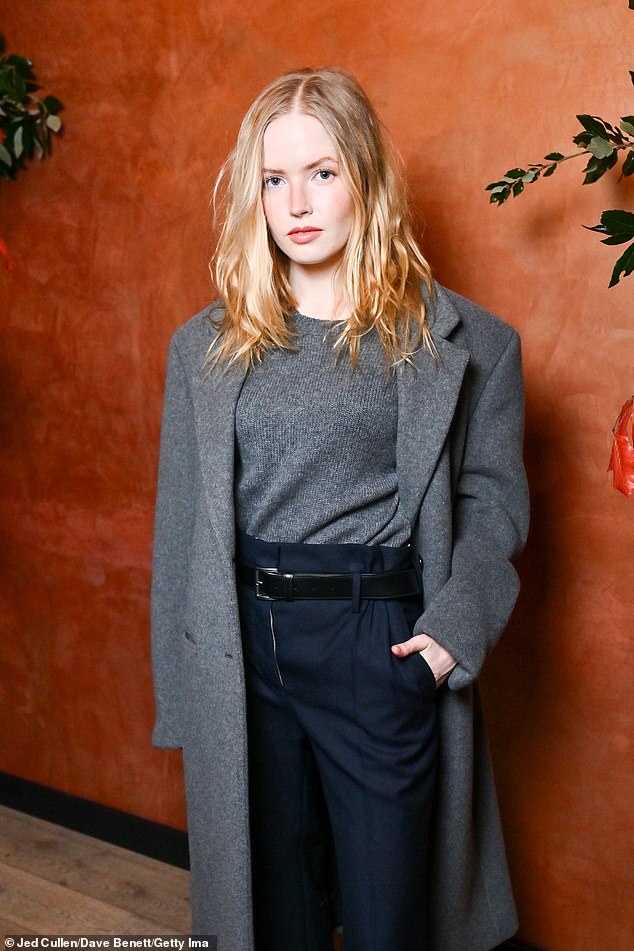 Ellie completed the look with a gray sweater tucked into her pants and a pair of stiletto boots.