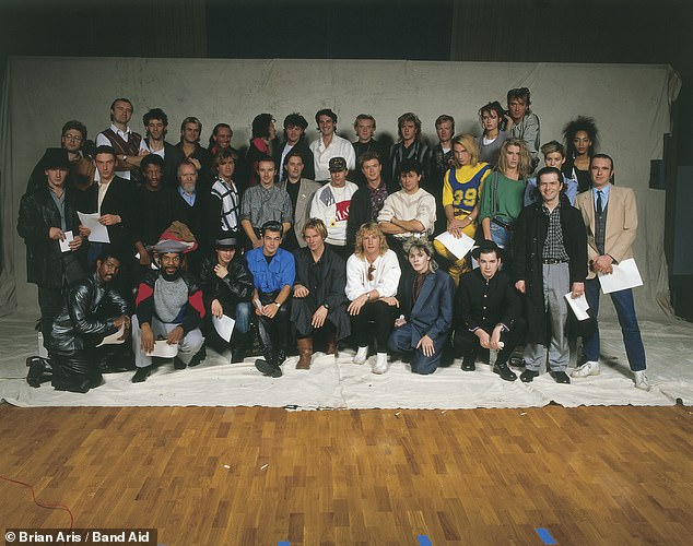 Band Aid have returned with a new version to mark the 40th anniversary of the iconic charity song (pictured are the stars of the original 1984 song).