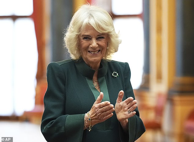 It was announced that Queen Camilla will no longer be able to attend as she continues to recover from a chest infection (pictured on Thursday at a reception for the winners of the Queen's Commonwealth Essay Competition)