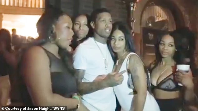 Rapper Lil Durk was filmed posing with several curvaceous women scantily clad in tiny mini dresses and bras