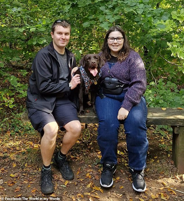 Holly pictured with her husband James, who she has been dating since she was a teenager and is getting married this year, and her chocolate Labrador Penny.