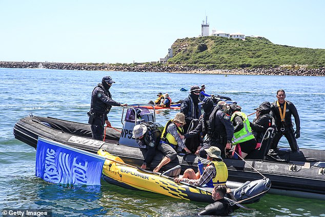 Officers in police inflatable boats and jet skis were seen dragging protesters toward police boats.