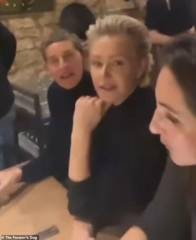 In a video posted next to the watering hole, Ellen and Portia were among those listening to the Irish band perform a relaxed acoustic performance.