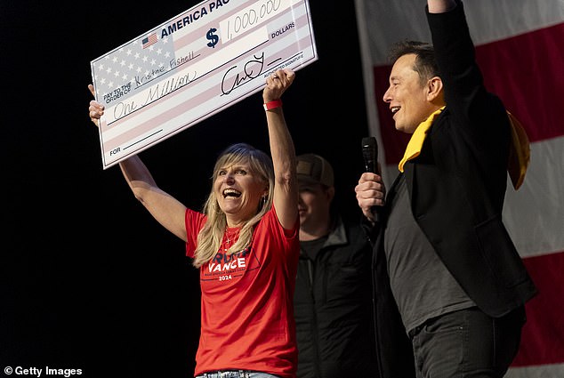 SpaceX and Tesla founder Elon Musk presented Kristine Fishell with a $1 million check during the town hall at the Roxain Theater on October 20, 2024 in Pittsburgh, Pennsylvania.