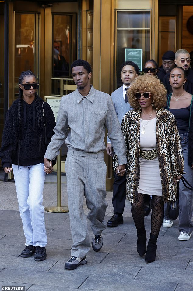 Far-right Janice Combs leaves a Manhattan federal courthouse with her grandchildren.