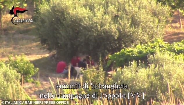 An image taken from a video distributed by the Italian Carabinieri press office on December 19, 2019 shows an undated meeting of mafia bosses from the south of the 'Ndrangheta.